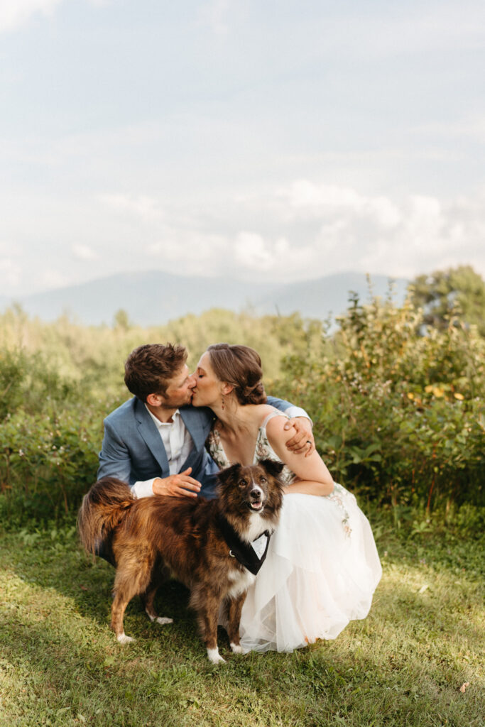 A couple and their dog at the elopement in the white mountains. 