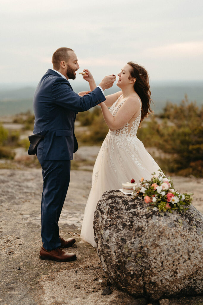 Cake and flowers at a mountain top maine elopement