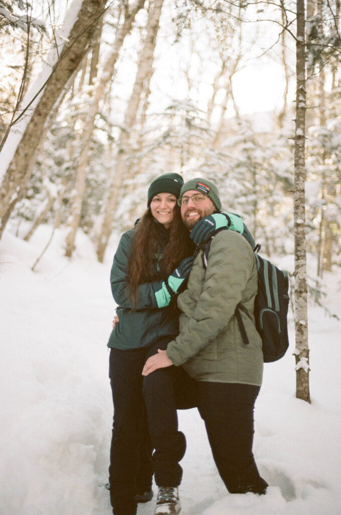 A couple on the snowy trail going up to Mount Willard