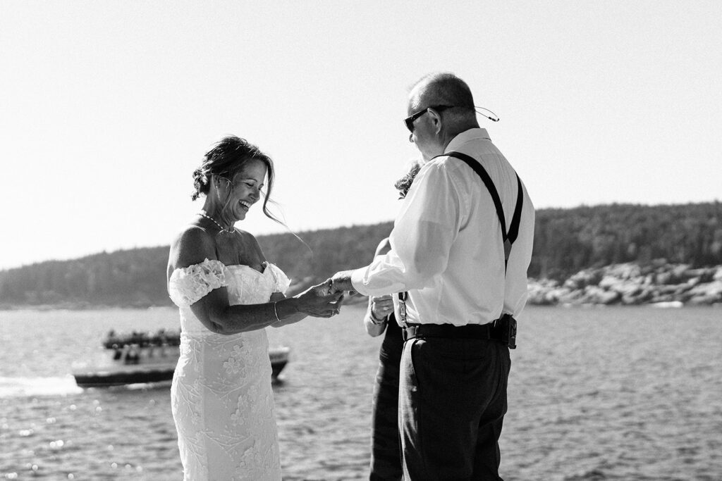Exchanging rings at an Otter Point elopement ceremony.