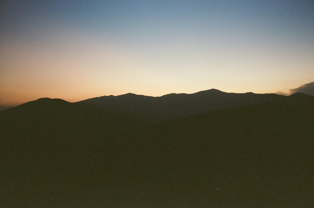 The sky starting to change colors at a sunrise elopement