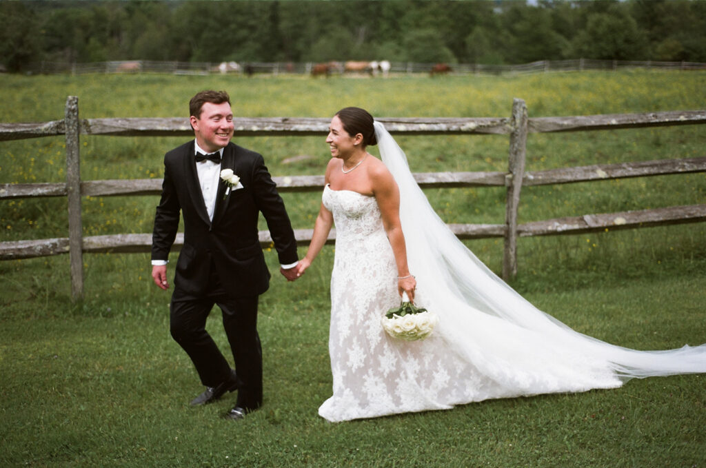 The couple walking in front of the horse pasture at Mountain Top Resort 