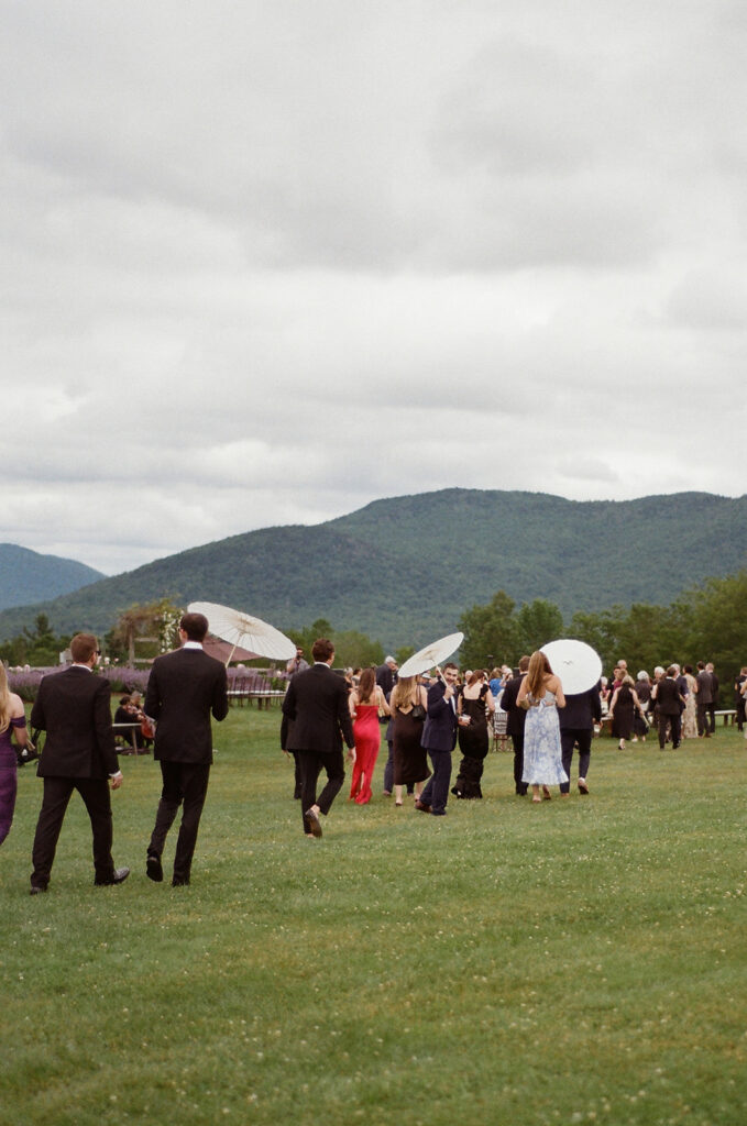 The guests walking towards the ceremony site on the Knoll at Mountain Top Resort. 