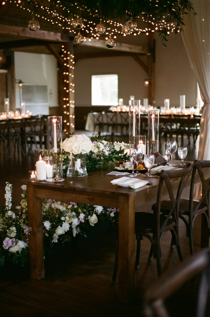 A photo of the couple's sweetheart table in The Barn at Mountain Top Resort. 