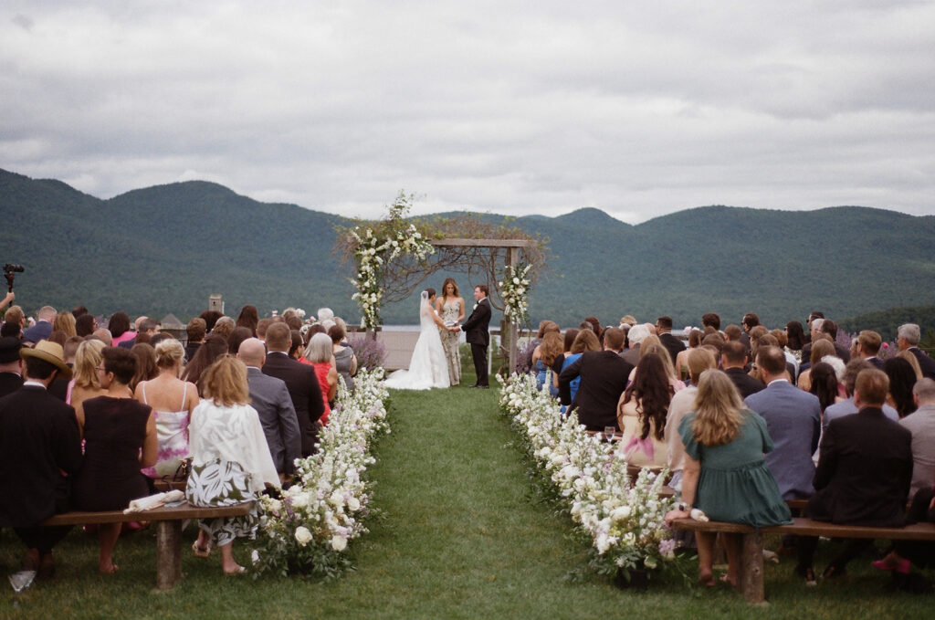 A wide ceremony shot where you can see all the guests, the couple, and the mountains. 