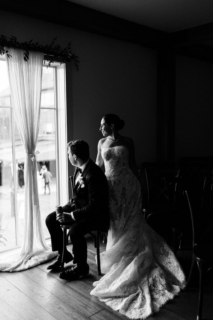The couple looking out at their cocktail hour from The Loft at Mountain Top Resort