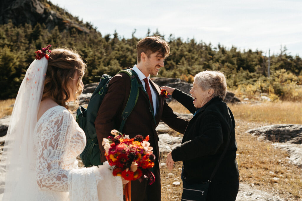 The groom embracing the brides grandmother on their Mount Mansfield elopement day. 