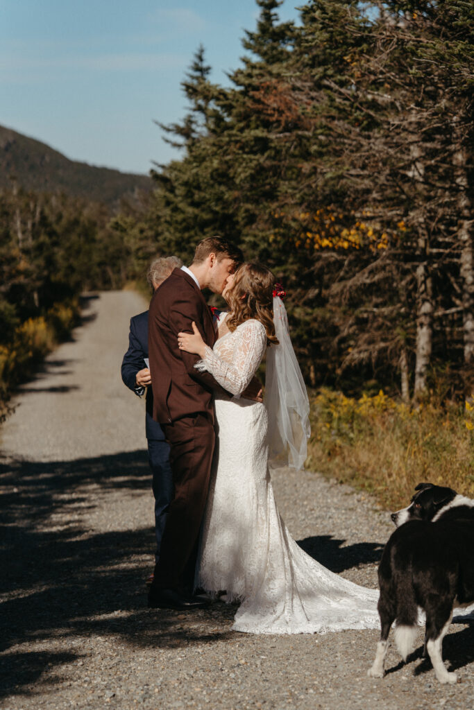 The couple kissing at their Mount Mansfield elopement ceremony. 